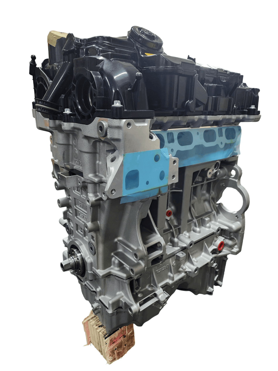 Remanufactured BMW 520i 2.0L N20B20 4-cylinder turbo engine motor, showing detailed components and design.