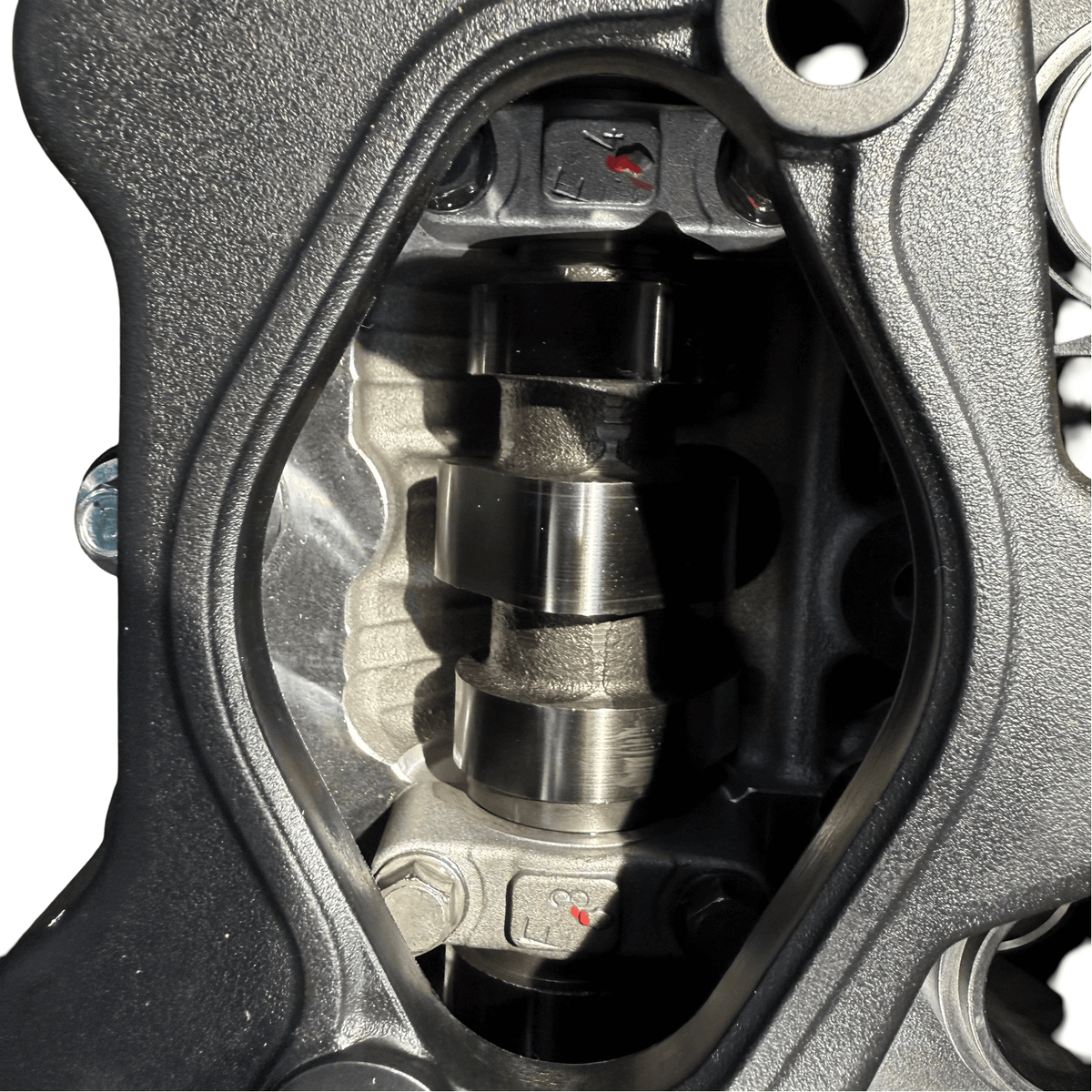 Close-up view of the camshaft inside a Kia Sportage 2.4L engine showing precision engineering.