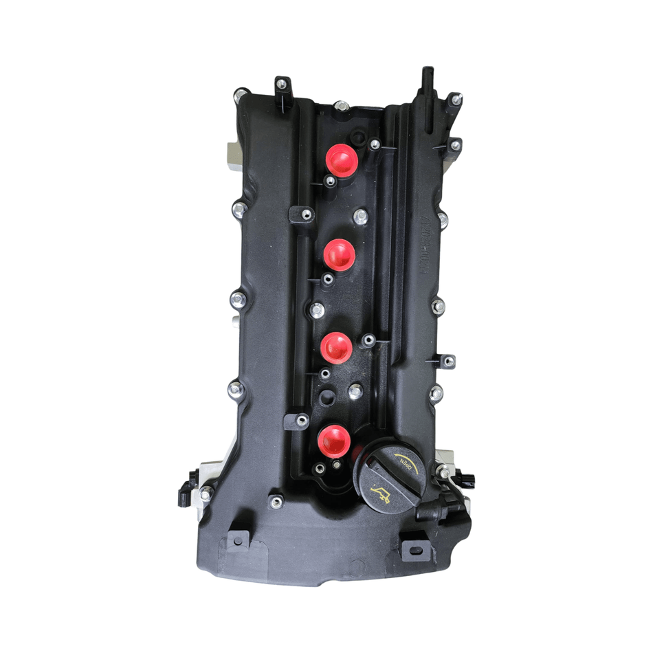 2010-2013 Hyundai Tucson engine valve cover with red rubber grommets and integrated sensor.