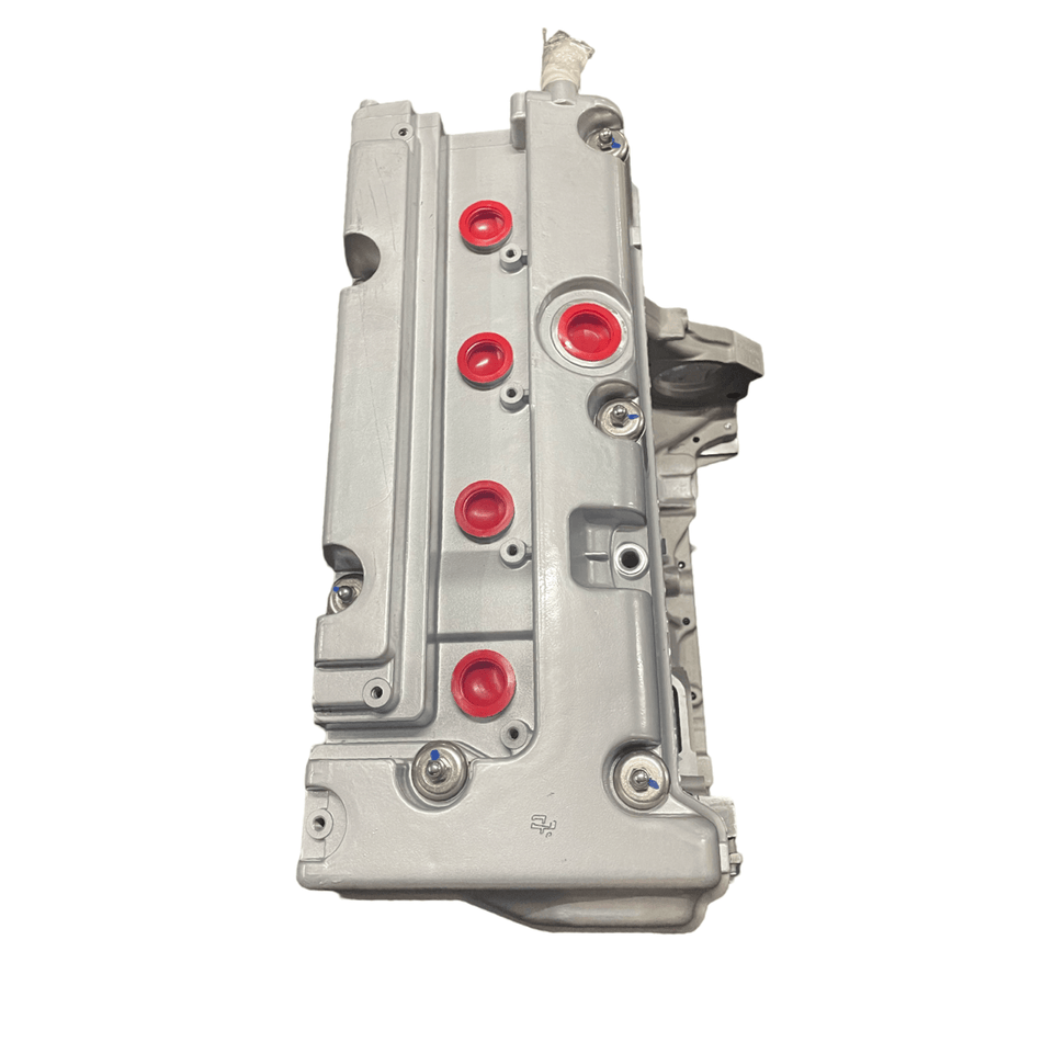 Remanufactured Honda CRV K24Z2 2.4L cylinder head with red seals, designed for 2010-2014 models.
