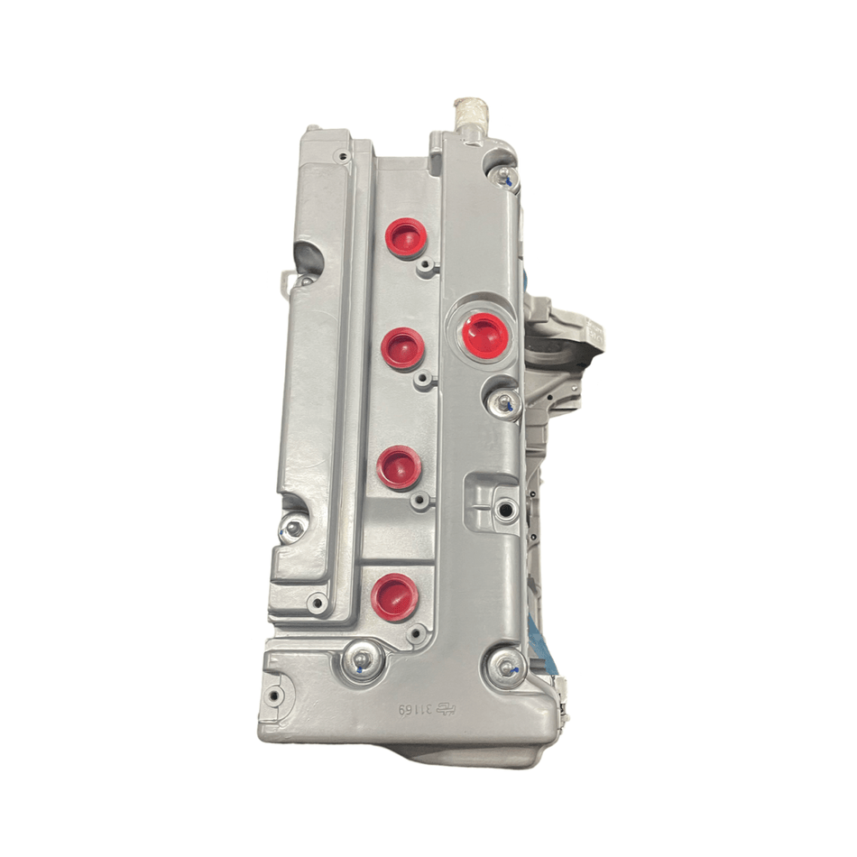 Remanufactured 2007-2011 Honda Element 2.4L K24A8 engine cylinder head with red grommets.